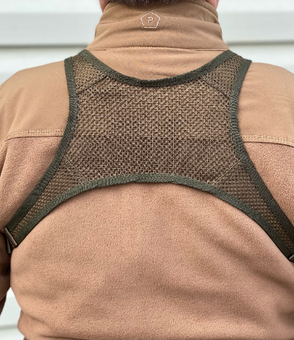 Harness with mesh panel on back